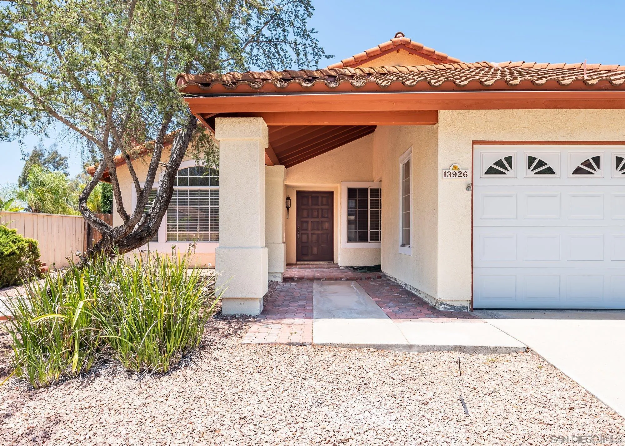 13926 Carriage Road Poway, CA 92064 - Photo 5 of 54 a front view of a house with garden