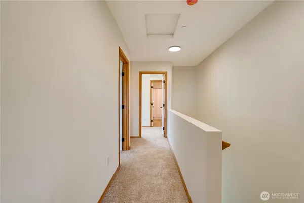 a view of a hallway with a white door