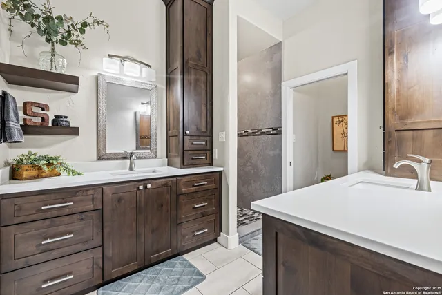 a bathroom with a sink and a mirror