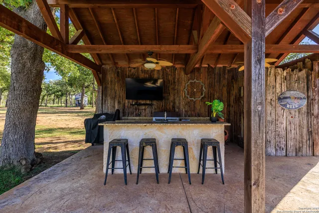 a dinning table and chairs in front of a house