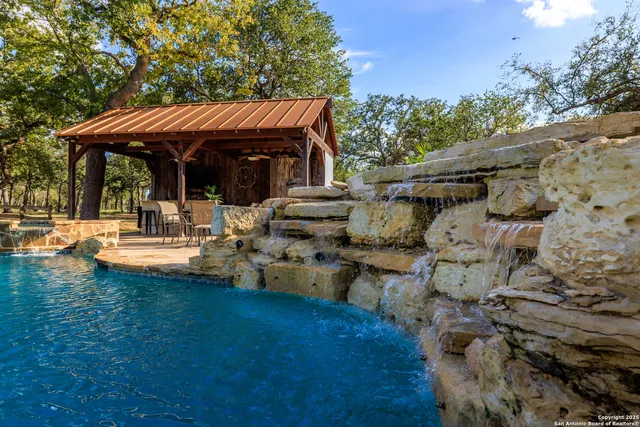 a view of swimming pool with outdoor seating