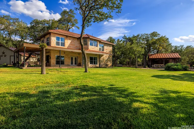 a view of a house with a big yard