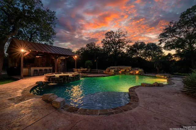 a view of a swimming pool and lounge chair