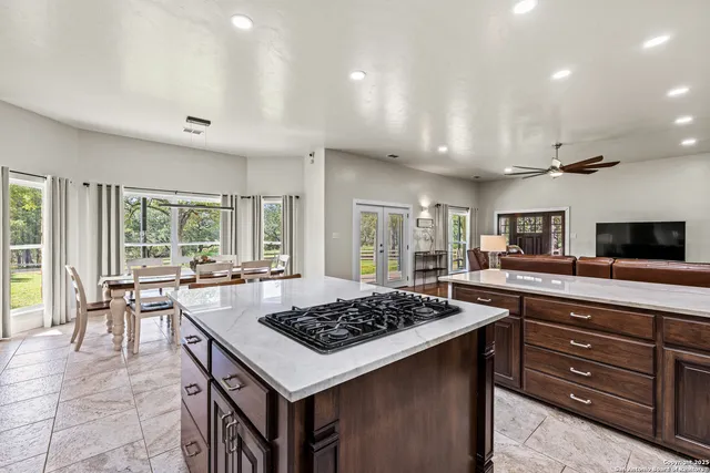 a kitchen with a stove a sink and a refrigerator