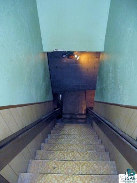 27780 Lincoln Road Mason, WI 54856 - Photo 18 of 25 Stairs to basement with Butler Wheel chair lift