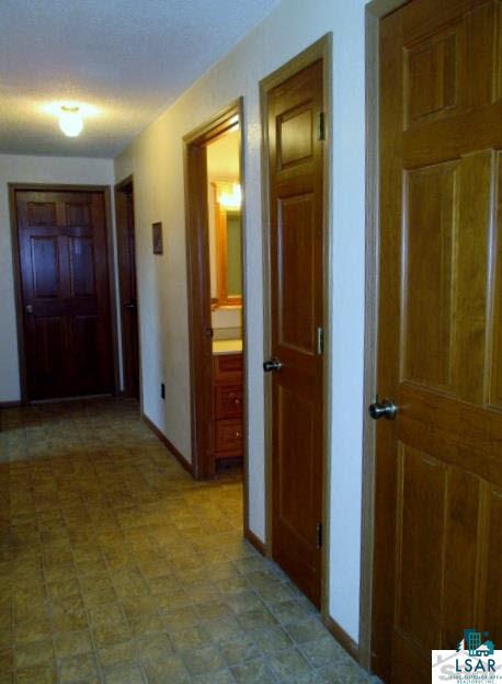 27780 Lincoln Road Mason, WI 54856 - Photo 10 of 25 Hallway basement to right bathroom then three bedrooms