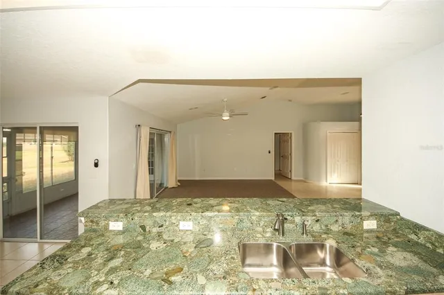 a large kitchen with cabinets and stainless steel appliances