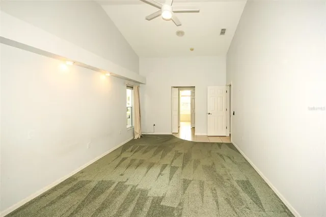 a view of an empty room with a window