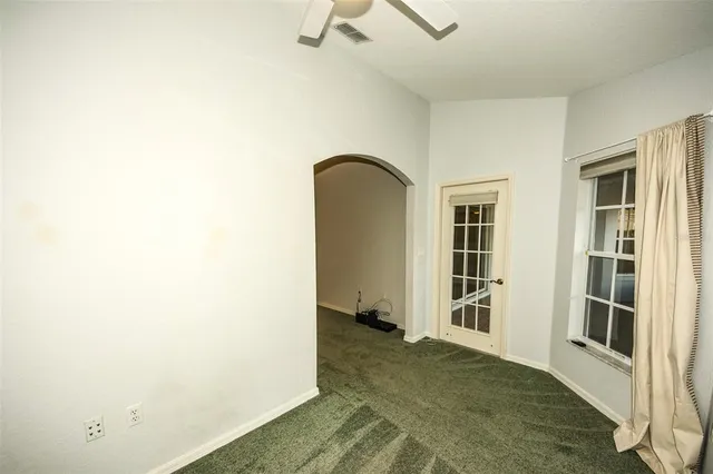 a bath tub sitting in a bathroom next to a window