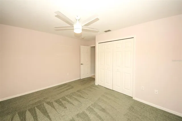 a spacious bathroom with a shower sink and mirror