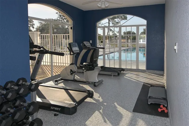 a view of a swimming pool with outdoor seating