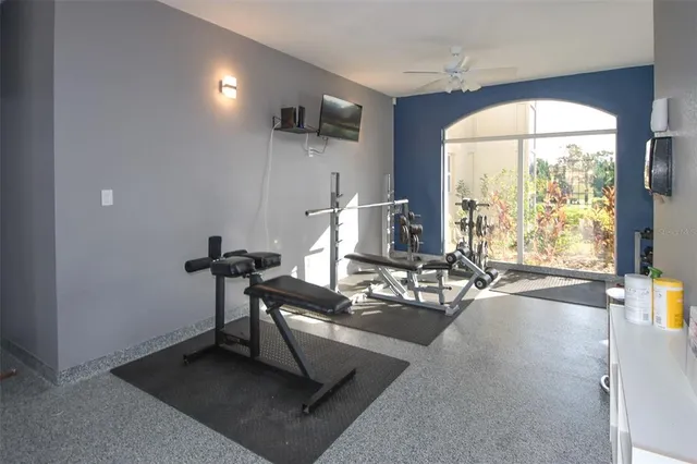 a view of a patio with couches and table and chairs and potted plants