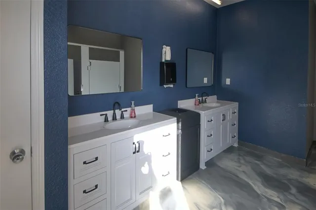 a view of a swimming pool with outdoor seating