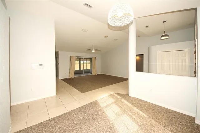 a spacious bathroom with a granite countertop sink a mirror and a shower