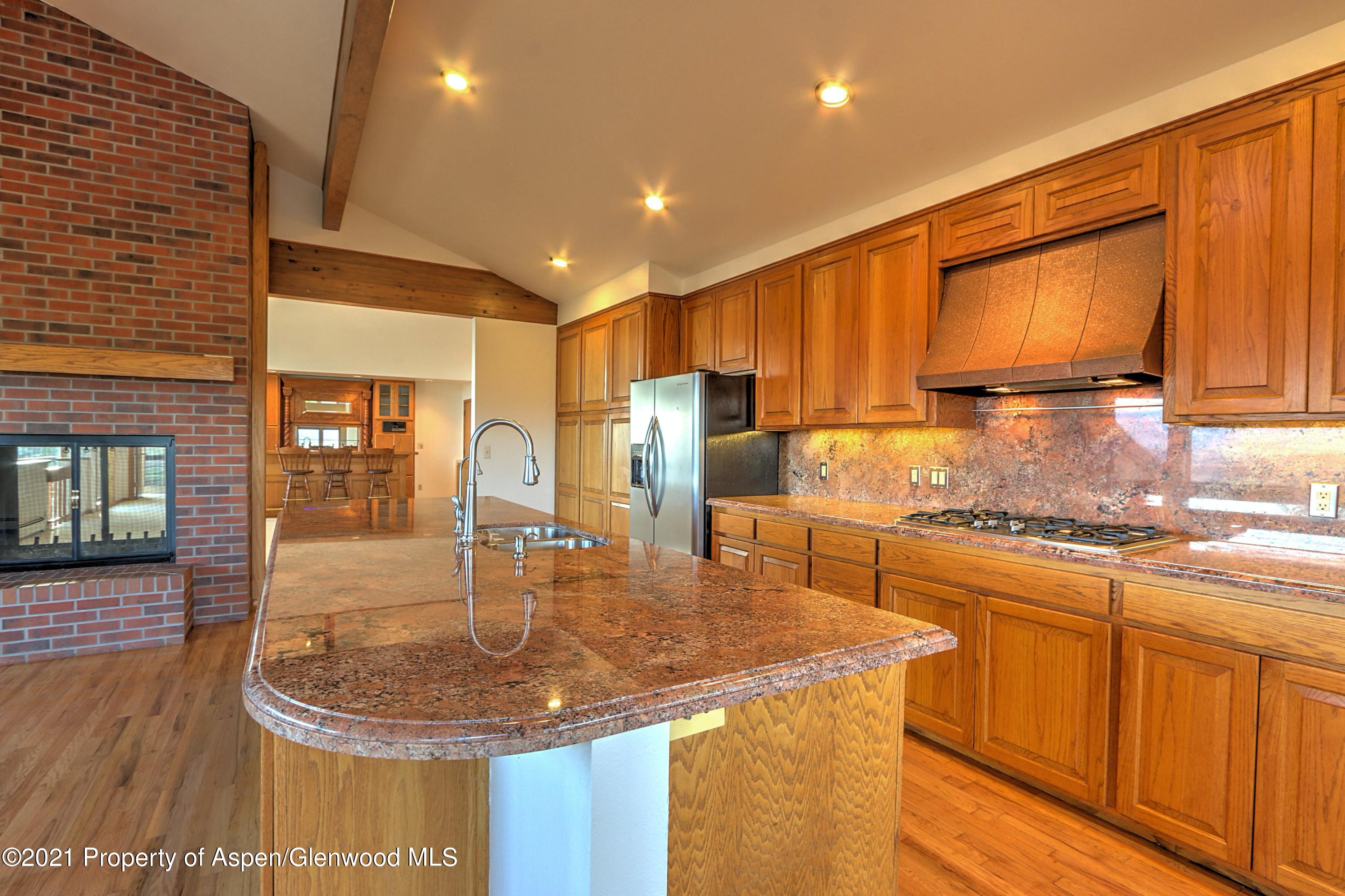 534 Panoramic Drive Silt, CO 81652 - Photo 11 of 48 a kitchen with stainless steel appliances granite countertop a sink a stove and a refrigerator