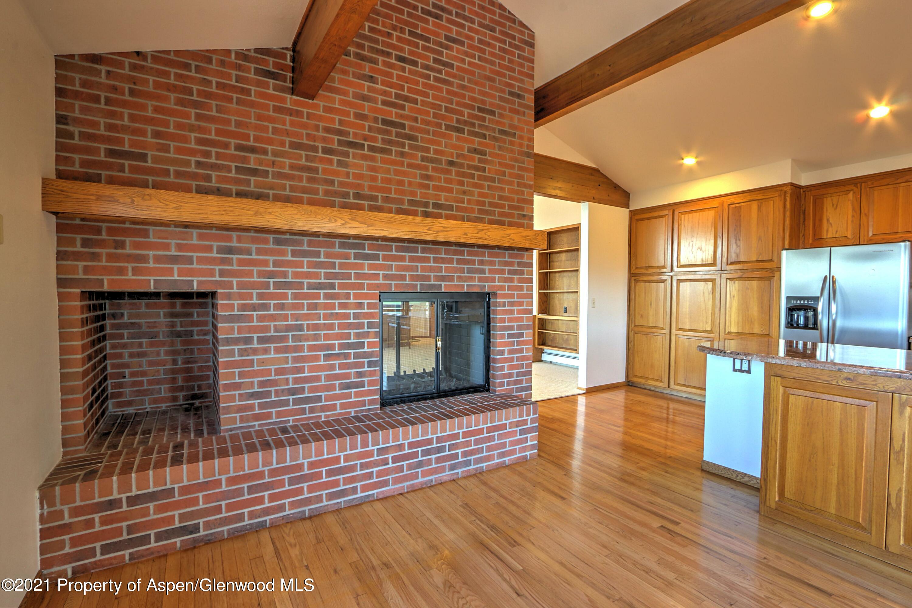 534 Panoramic Drive Silt, CO 81652 - Photo 13 of 48 a view of a refrigerator in kitchen and wooden floor