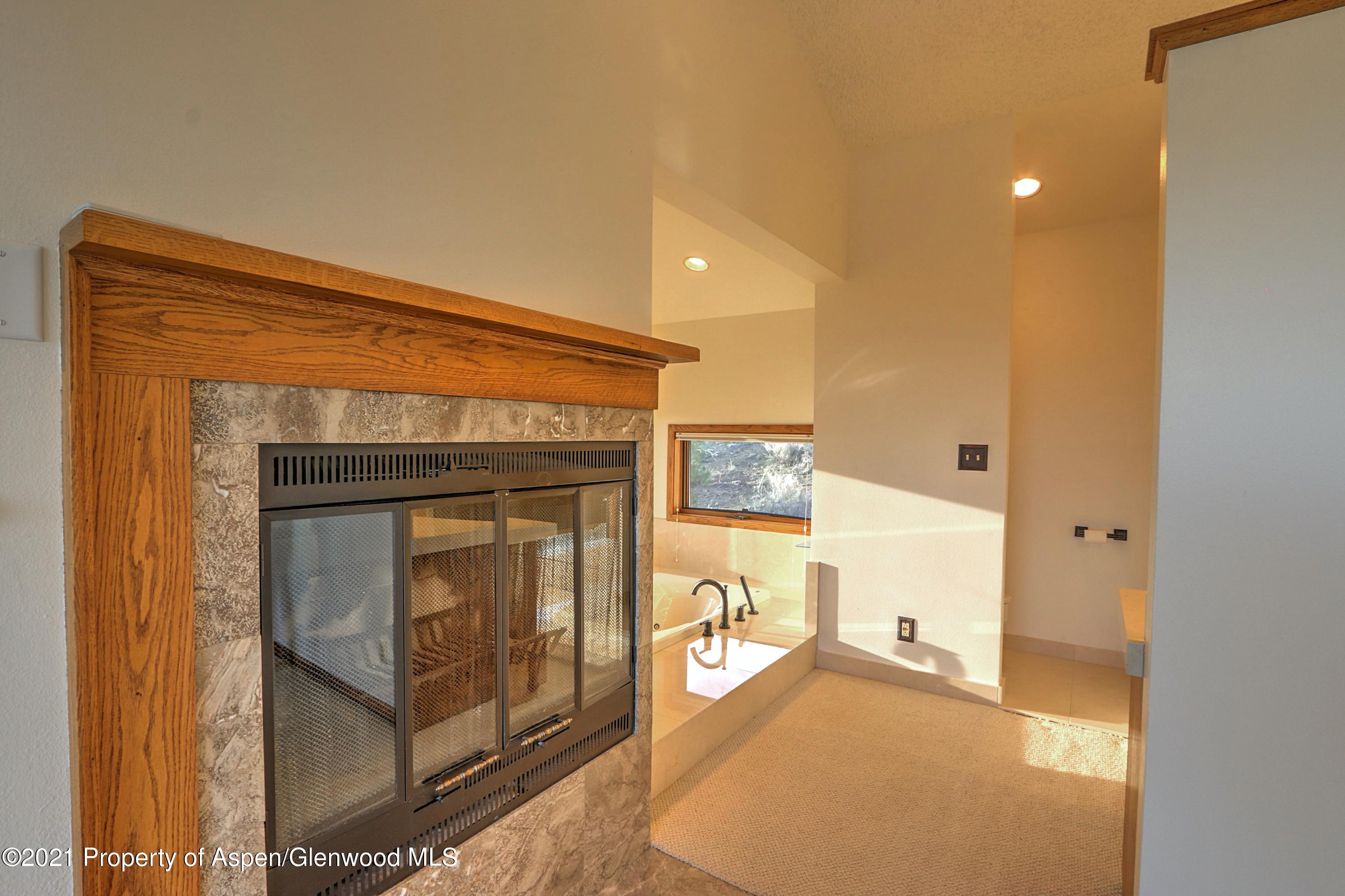 534 Panoramic Drive Silt, CO 81652 - Photo 19 of 48 a view of an empty room and a bathroom with mirror