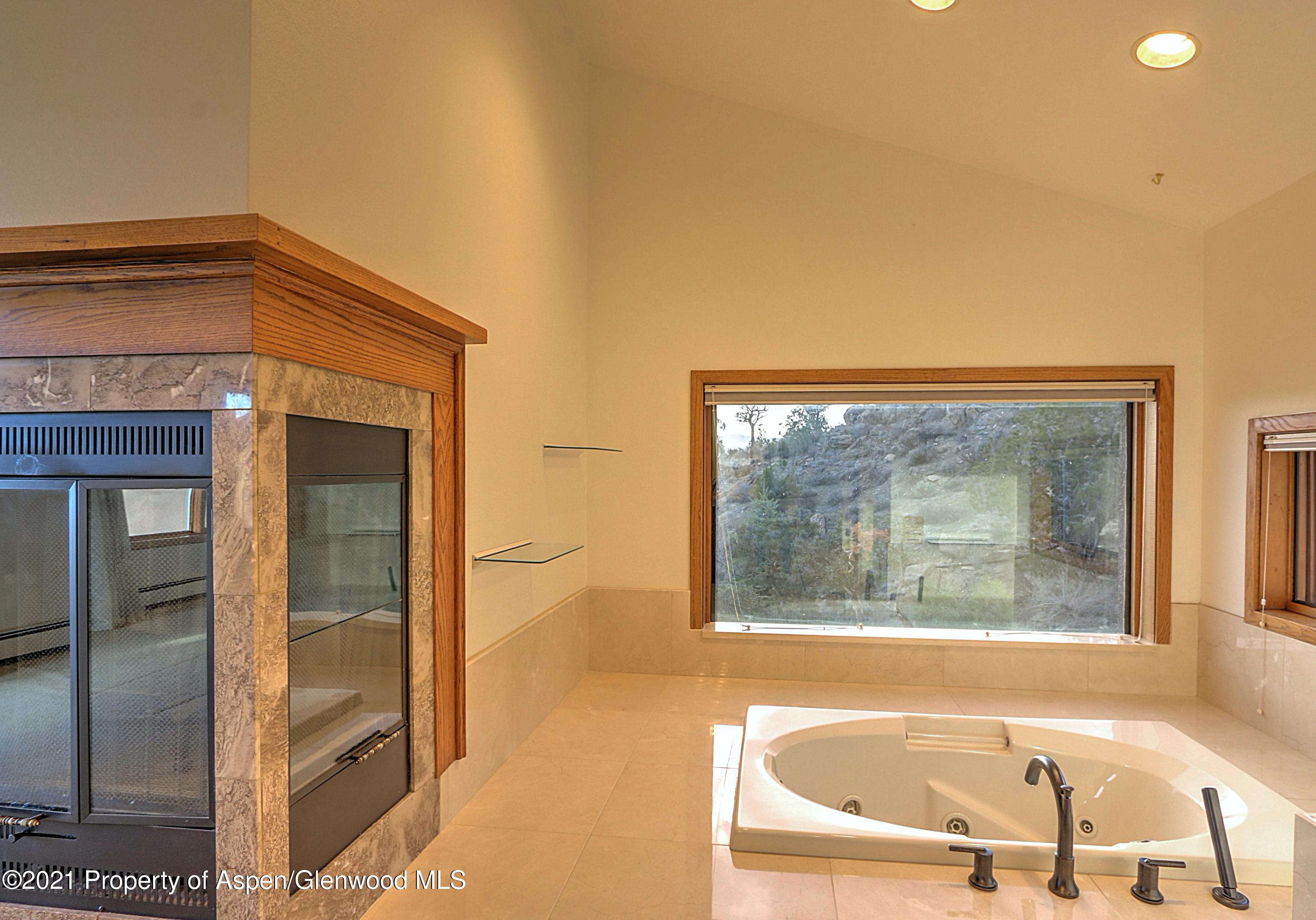 534 Panoramic Drive Silt, CO 81652 - Photo 20 of 48 a bathroom with a bathtub and a shower