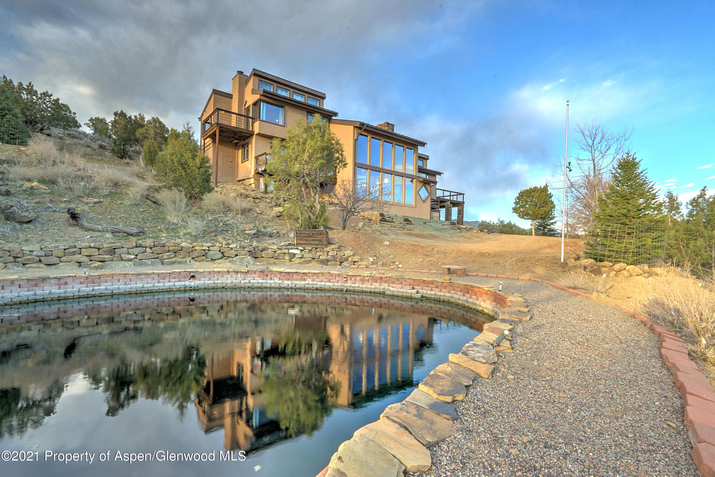 534 Panoramic Drive Silt, CO 81652 - Photo 2 of 48 a view of a swimming pool with a lake view
