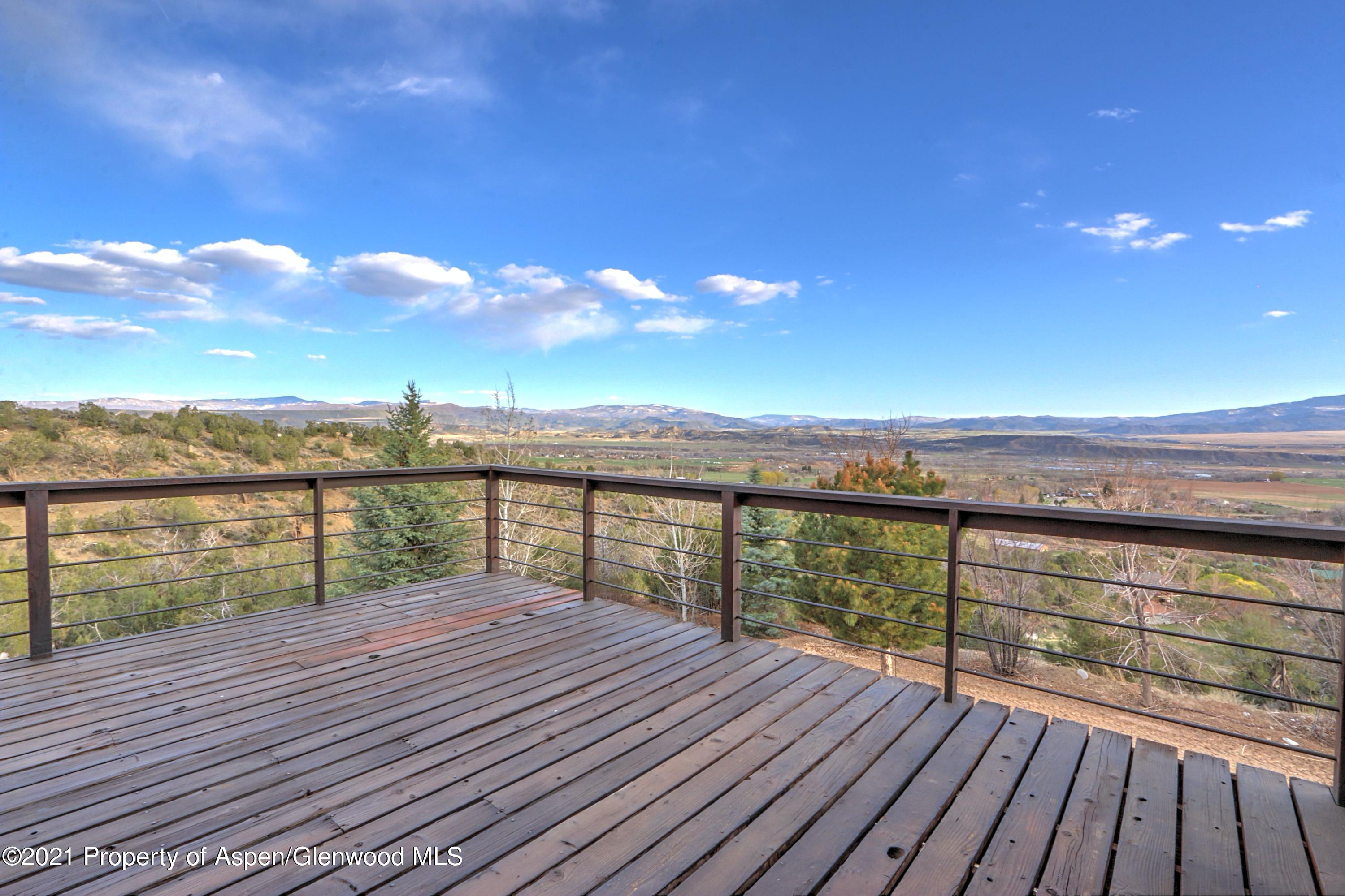 534 Panoramic Drive Silt, CO 81652 - Photo 28 of 48 a view of roof deck with two chairs and wooden floor