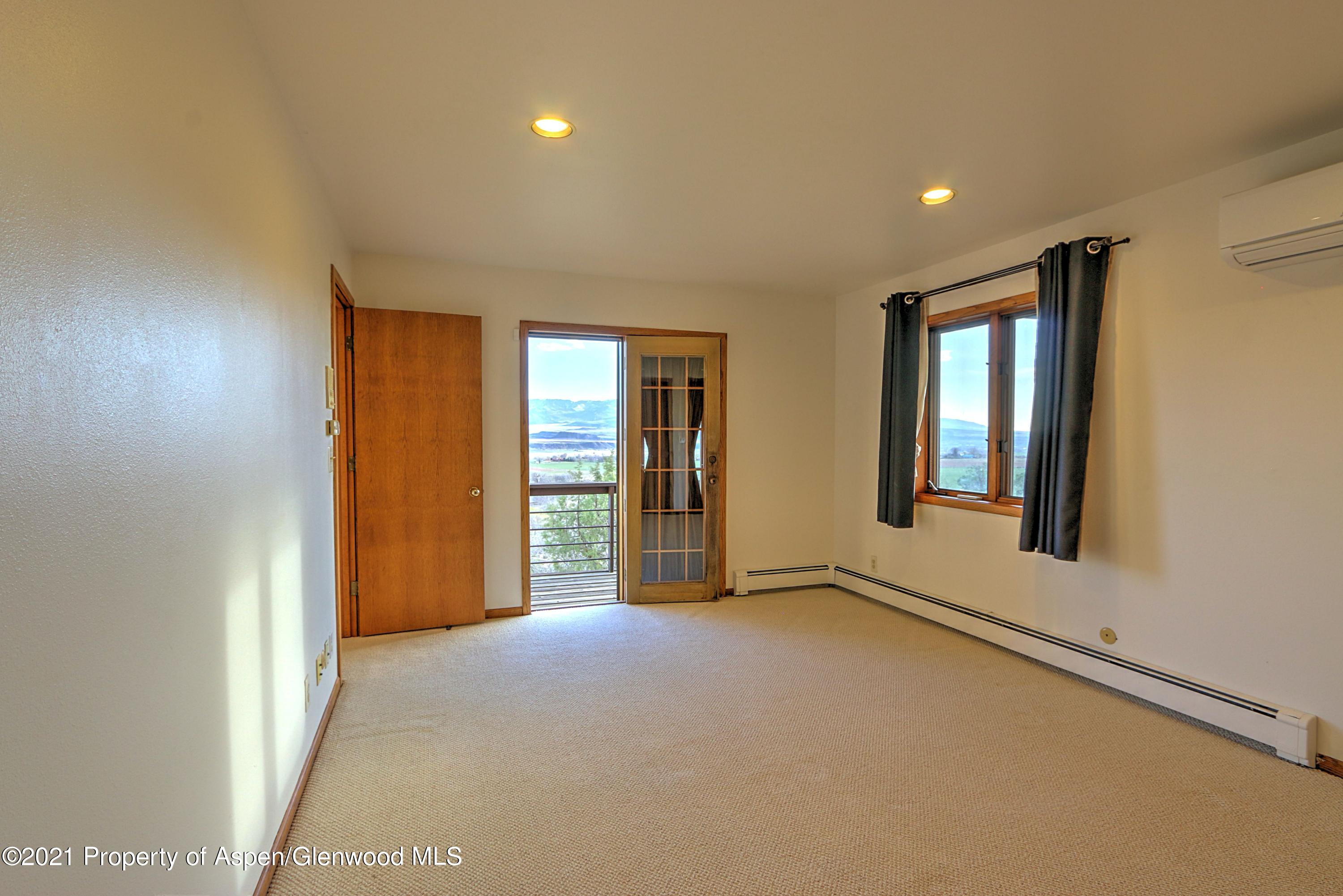 534 Panoramic Drive Silt, CO 81652 - Photo 35 of 48 an empty room with windows and closet