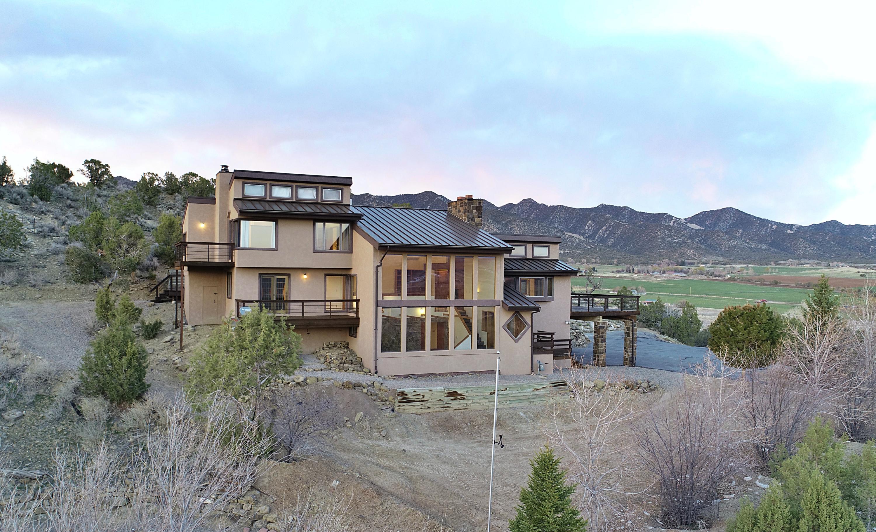 534 Panoramic Drive Silt, CO 81652 - Photo 4 of 48 an aerial view of a house with a yard and mountain view in back