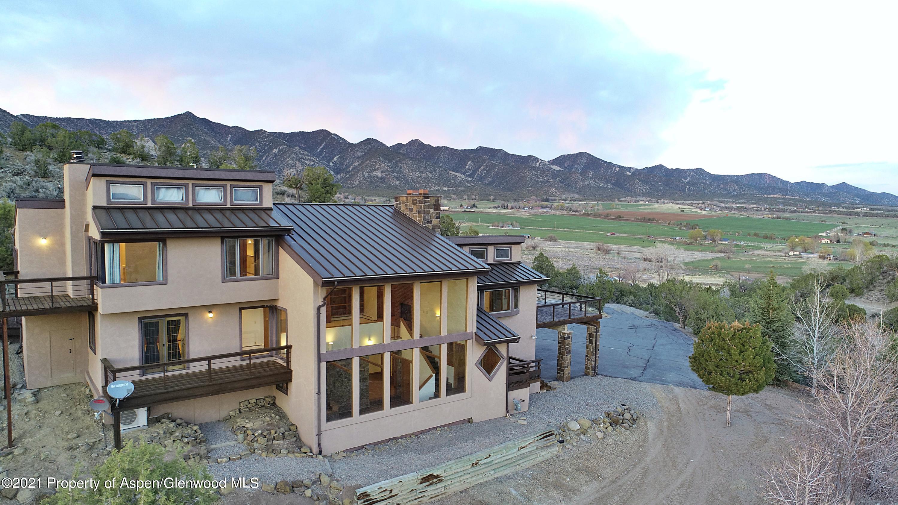 534 Panoramic Drive Silt, CO 81652 - Photo 5 of 48 a front view of a house with a yard and mountain view in back