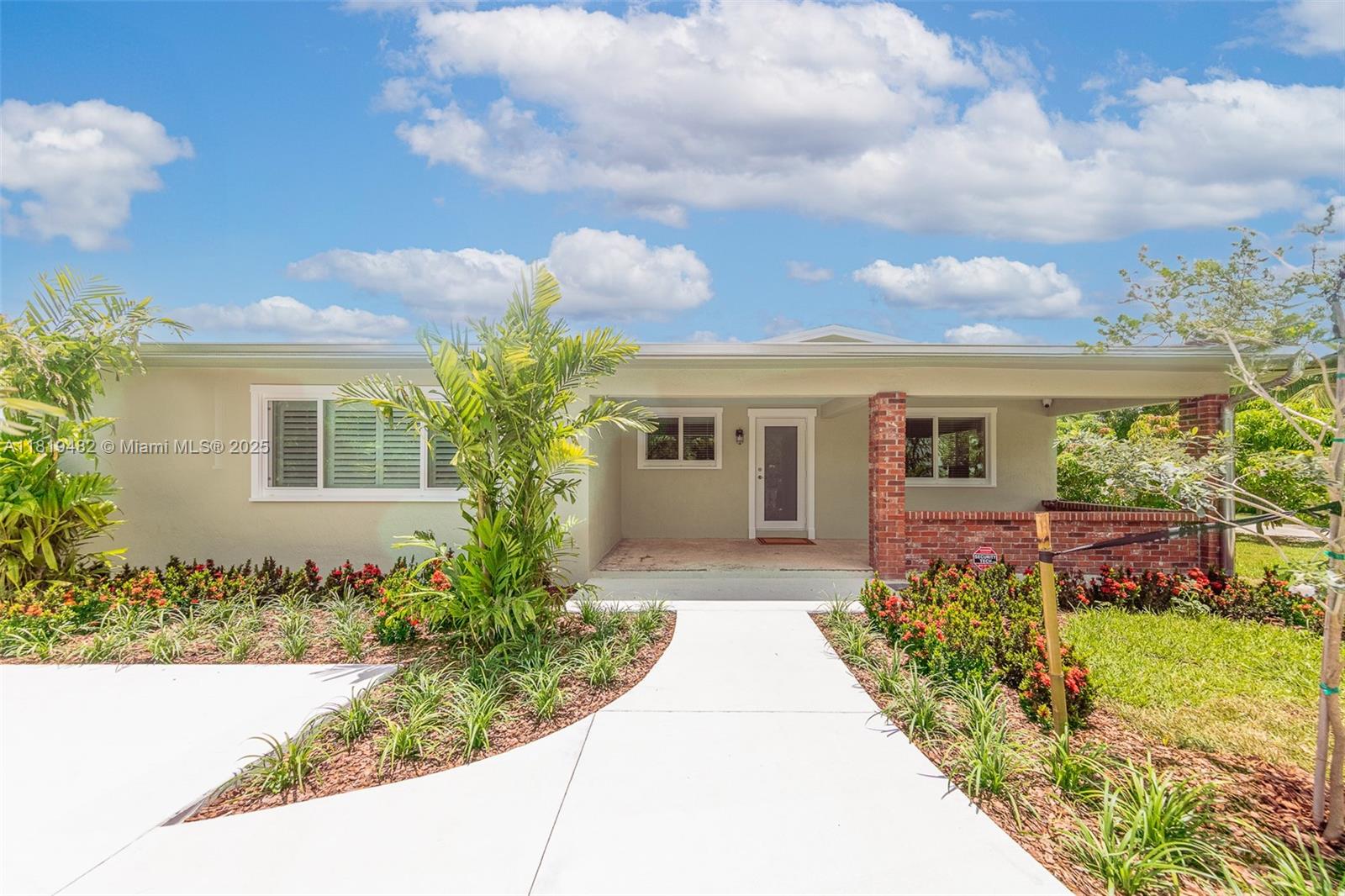 front view of a house with a small yard