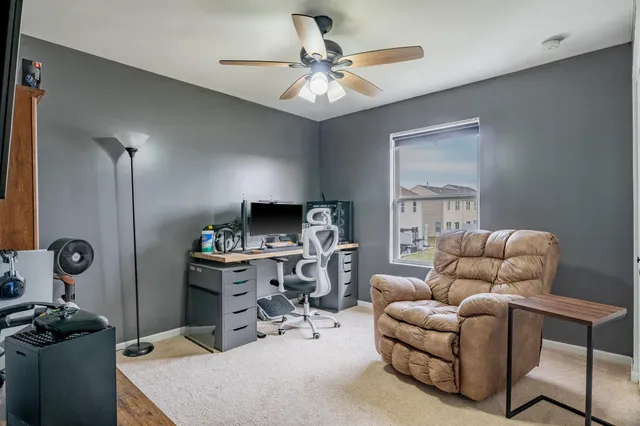 a living room with furniture a chandelier and a window