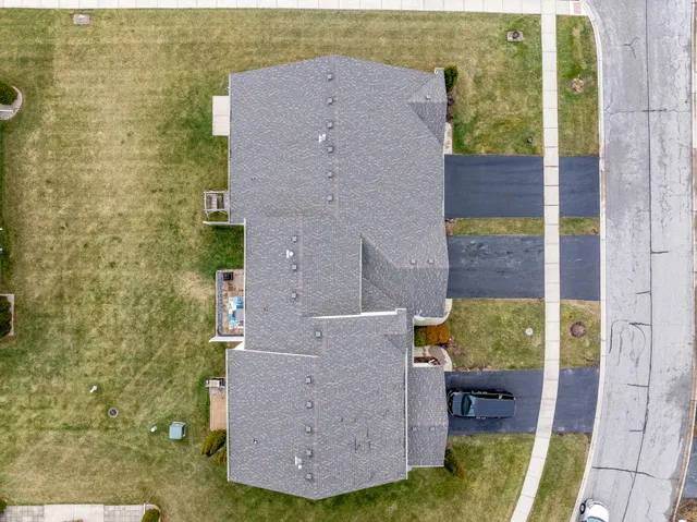 an aerial view of a house with a ocean view
