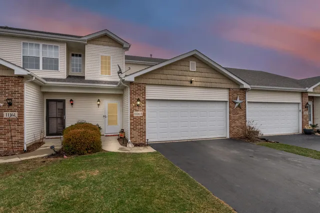a view of a backyard with sitting area