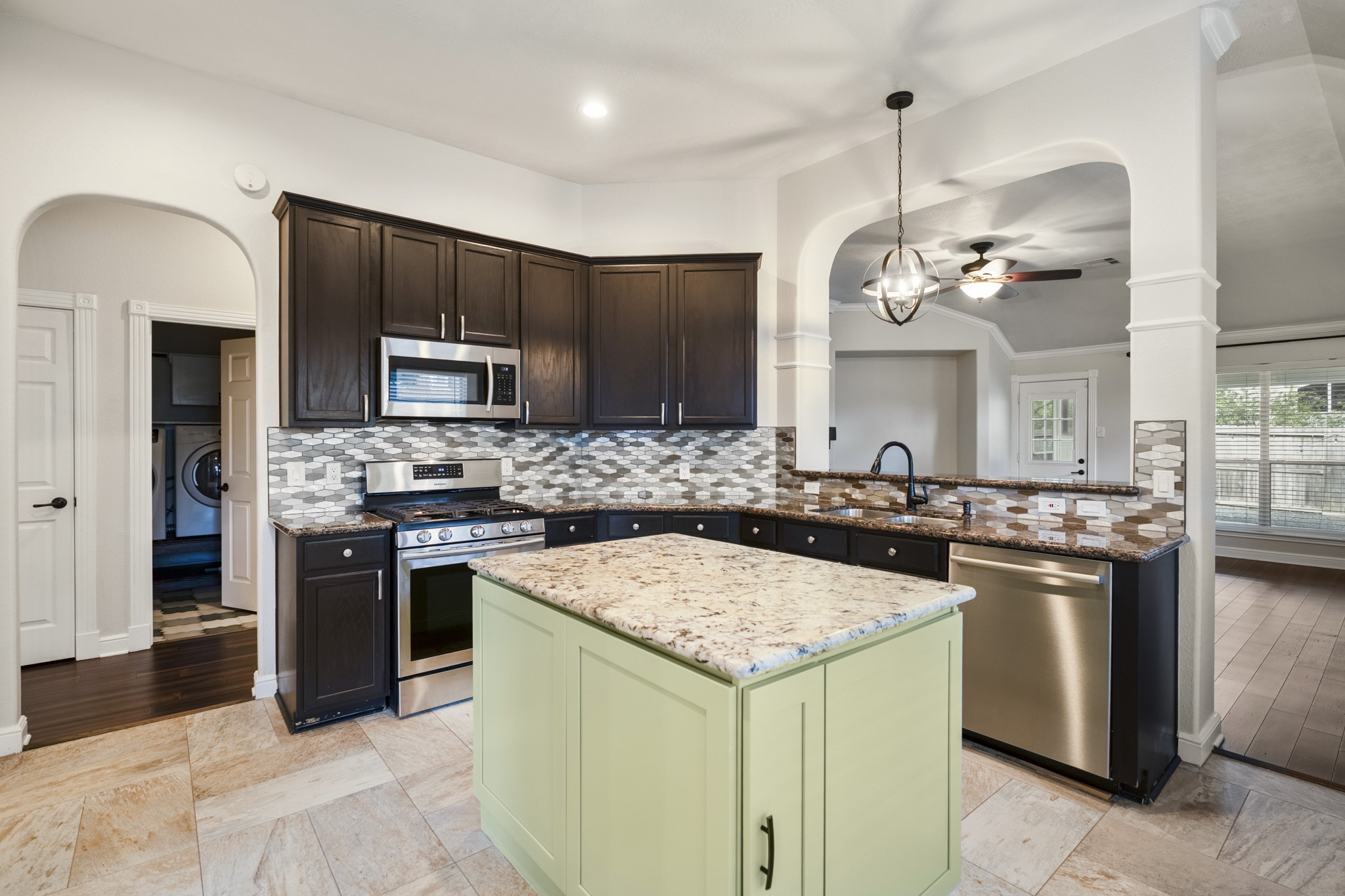 5802 Sawyer Bend Lane Spring, TX 77379 - Photo 9 of 50 a kitchen with a stove and a sink