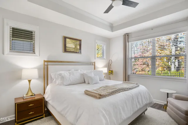 a bedroom with a bed and a tv