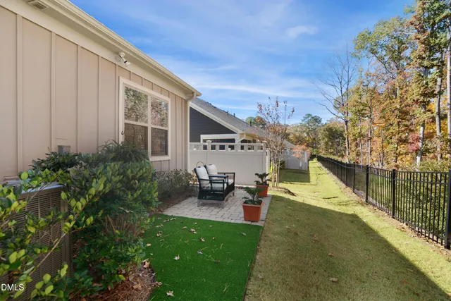 a view of a house with swimming pool and sitting area