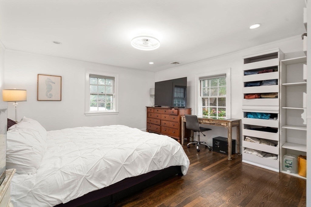 14 Sunset Road Wellesley, MA 02482 - Photo 19 of 39 a bedroom with a bed and a chair