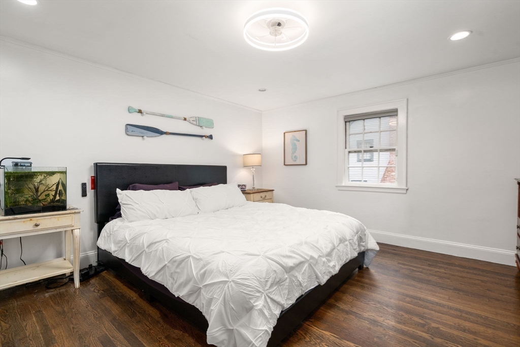 14 Sunset Road Wellesley, MA 02482 - Photo 20 of 39 a bedroom with a bed and a flat screen tv