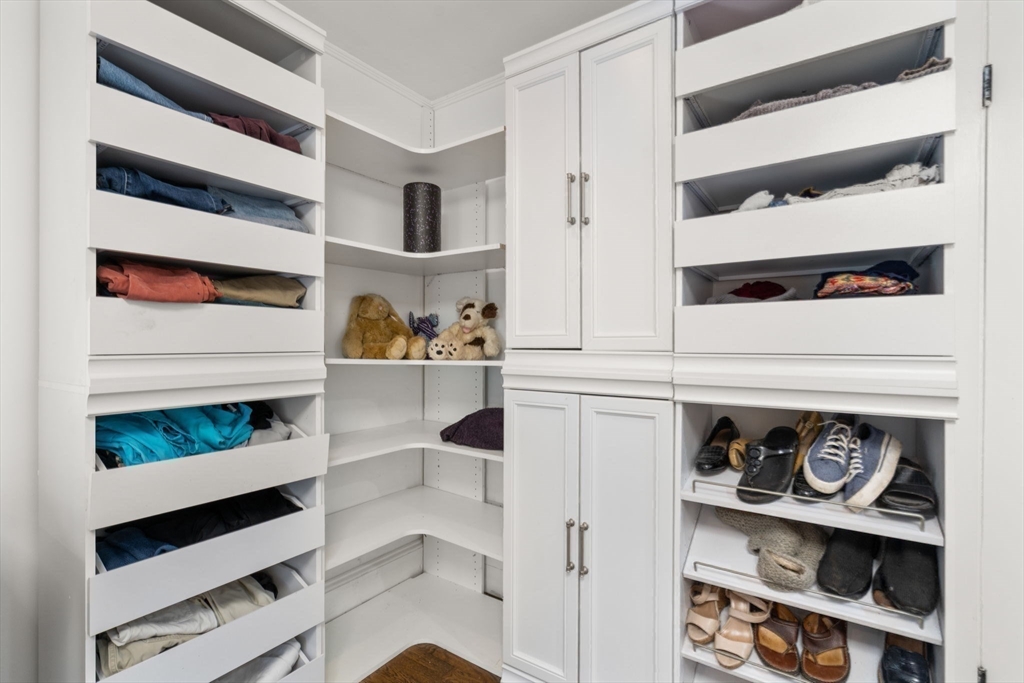 14 Sunset Road Wellesley, MA 02482 - Photo 21 of 39 a view of walk in closet with clothes and shoes