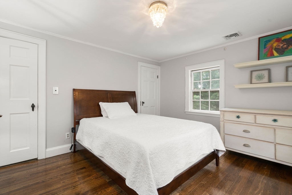 14 Sunset Road Wellesley, MA 02482 - Photo 23 of 39 a bedroom with a large bed and a window