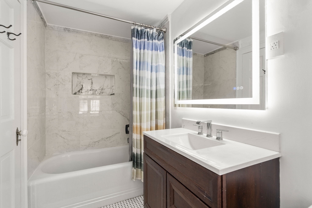 14 Sunset Road Wellesley, MA 02482 - Photo 24 of 39 a bathroom with a sink mirror toilet and bathtub
