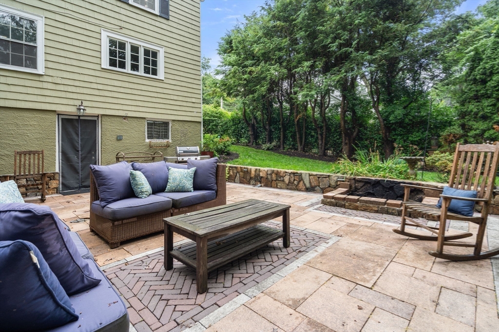 14 Sunset Road Wellesley, MA 02482 - Photo 30 of 39 a outdoor space with patio the couches and a dining table and chairs with garden view