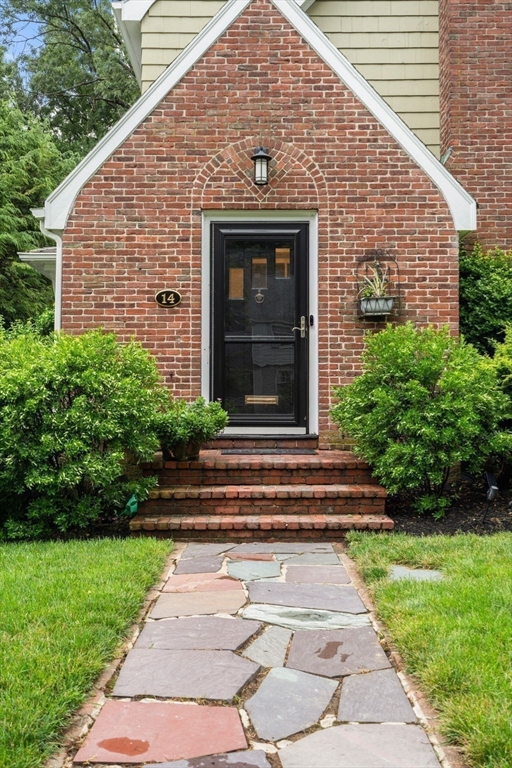 14 Sunset Road Wellesley, MA 02482 - Photo 3 of 39 a front view of a house with garden