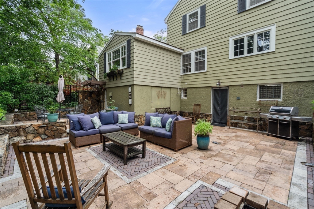 14 Sunset Road Wellesley, MA 02482 - Photo 34 of 39 a view of a patio with couches and potted plants