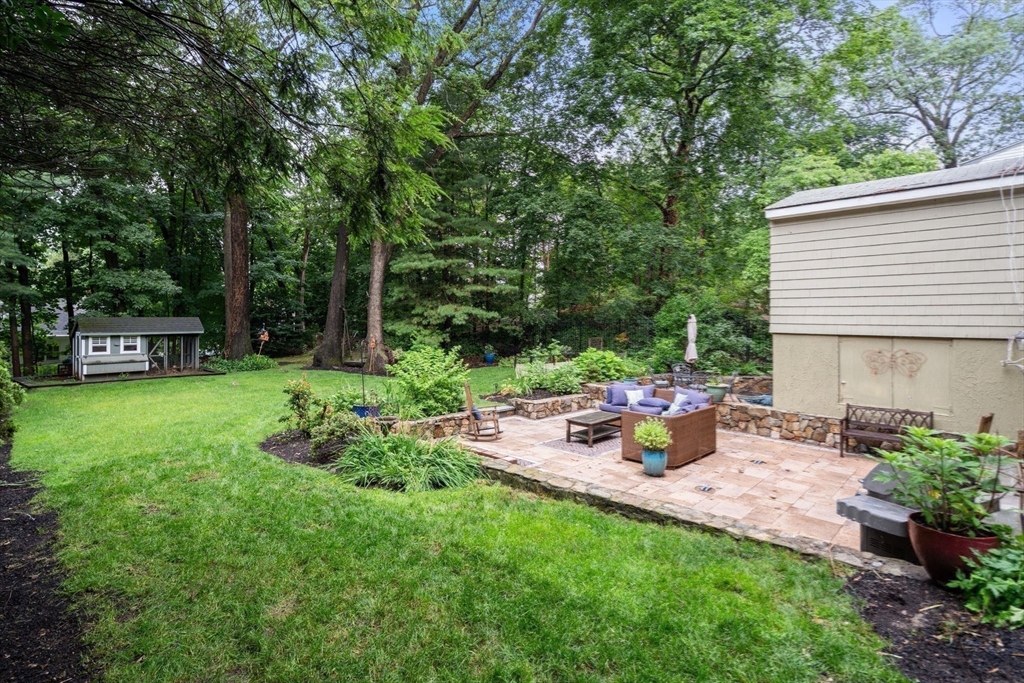 14 Sunset Road Wellesley, MA 02482 - Photo 38 of 39 a view of a chair and table in the garden