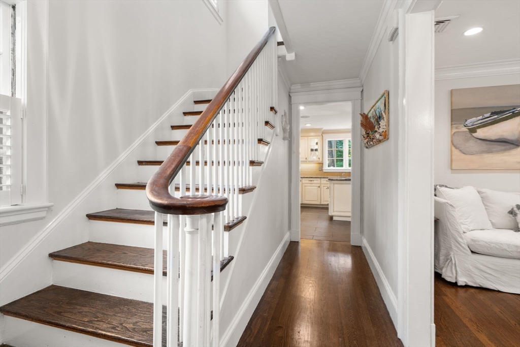 14 Sunset Road Wellesley, MA 02482 - Photo 4 of 39 a view of a hallway with wooden floor and staircase