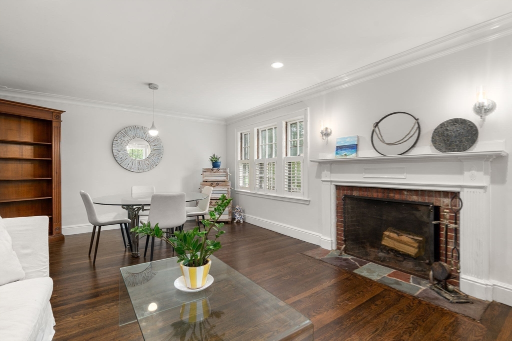14 Sunset Road Wellesley, MA 02482 - Photo 6 of 39 a living room with furniture a fireplace and a potted plant