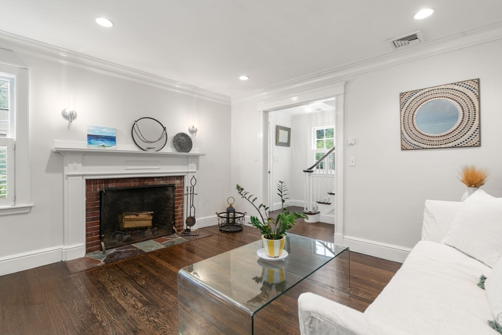 14 Sunset Road Wellesley, MA 02482 - Photo 9 of 39 a living room with furniture and a fireplace