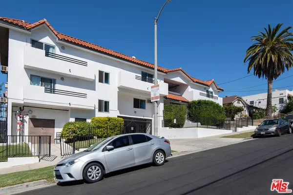 a car parked in front of a house