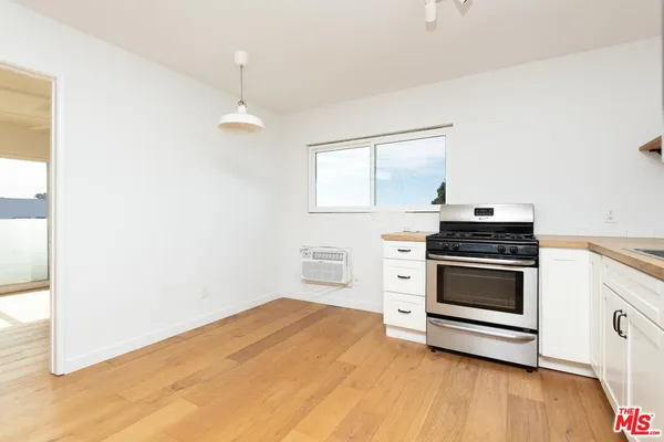 a kitchen with a stove and a microwave