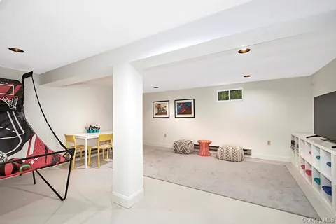 a view of a livingroom with furniture and white walls
