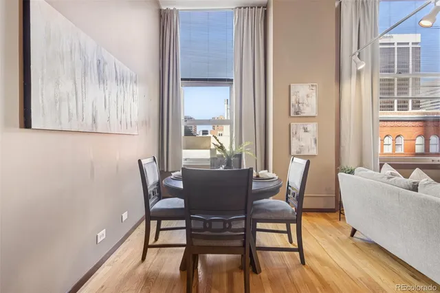 a view of a dining room with furniture and wooden floor